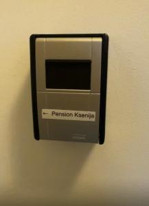 a wall outlet with a pentition klezvisor on it at Pension Ksenija Hanau in Hanau am Main