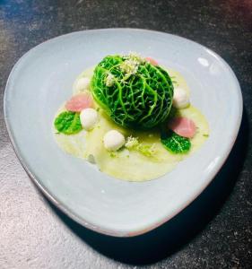 a plate of food with vegetables on a table at Auberge du Val d'Aisne in Fanzel +32 photos