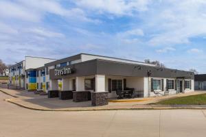 a building on a street with a picnic table outside at Days Inn by Wyndham Pierre in Pierre