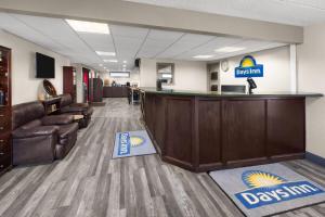 a dental office with a reception desk and chairs at Days Inn by Wyndham Pierre in Pierre