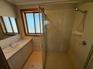 a bathroom with a shower and a sink at B & B on Yorkes in Edithburgh +20 photos