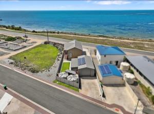 an aerial view of a house with the ocean in the background at B & B on Yorkes in Edithburgh