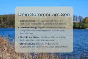 a sign that is next to some water at Hufe 9 Gute Stube - Digital Detox und Entschleunigen oder Aktiv-Urlaub in der Natur - Bauernhof Charme trifft modernes Design in Wustrow