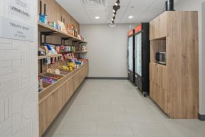 an aisle of a store with shelves of food at Hampton Inn & Suites Pharr in Pharr +31 photos