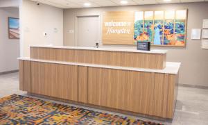 a welcomemonger counter in a hospital lobby at Hampton Inn Shrewsbury in Shrewsbury