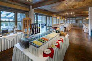 a buffet line with food on display in a restaurant at Sure Hotel by Best Western Rhoen Garden in Poppenhausen