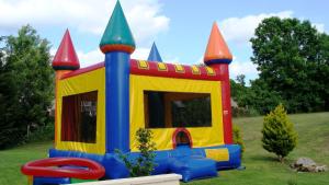 a childs play house in a yard at Grange Cottage - La Mare Chappey in Néhou