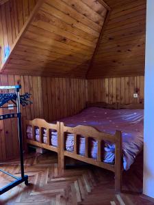 a wooden cabin with two bunk beds in a room at Vikendica na Drini in Banja Koviljača