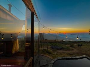 a view of the sunset from a house with lights at Skyridge Infinity in Nuwara Eliya +11 photos