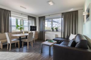a living room with a couch and a table at Haus Wiesenstein in Lana