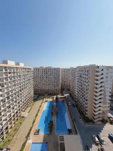 an aerial view of a large apartment complex with two pools at The Purrfect Stay in Lapu Lapu City