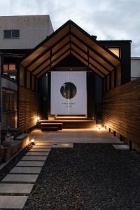 a building with a large screen in front of it at YOHAKU inuyama in Inuyama