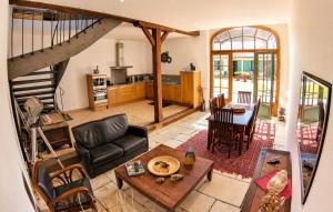 an aerial view of a living room with a staircase at La Closeraie in Noyers-sur-Cher