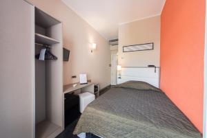 Postel nebo postele na pokoji v ubytování Reginna Palace Hotel