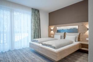 Letto o letti in una camera di Hotel Mathiesn