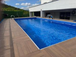 a swimming pool with blue water in a house at Next Suite in Trabzon