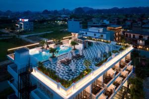 an overhead view of a building with a swimming pool at SaLa Tam Coc Hotel & Spa in Ninh Binh