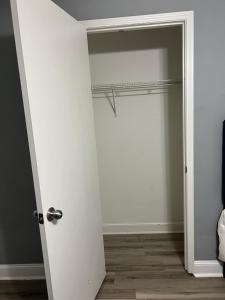 a white door with a closet in a room at Sweet Spot Stone Mountain in Stone Mountain