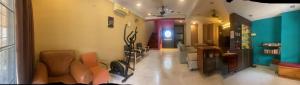 a living room with a couch and chairs in it at Dotties House in Subang Jaya