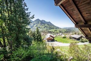 a view of a mountain from a house at Chalet Tante Emma proche Lac Leman in Vacheresse