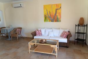 a living room with a couch and a table at Landhotel Can Davero in Binissalem