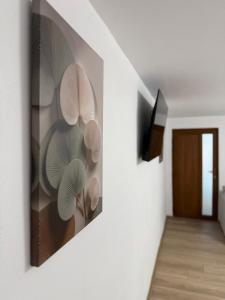 a hallway with a painting on the wall at Casa TeoMar in Brad
