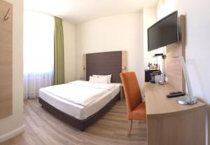 Postel nebo postele na pokoji v ubytování Apartmenthotel Kaiser Karl