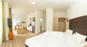 เตียงในห้องที่ Apartmenthotel Kaiser Karl