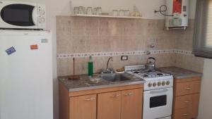 Køkken eller tekøkken på Complejo Playa Grande