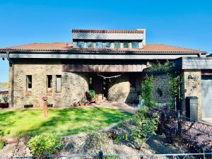 a large brick house with a yard in front of it at Castles Corner Bad Fallingbostel in Bad Fallingbostel