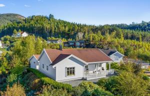 an aerial view of a white house with a brown roof at Villa Nygård in Jelsa