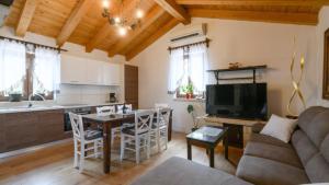 a kitchen and living room with a couch and a table at Villa Zebo by Villas Guide in Barban