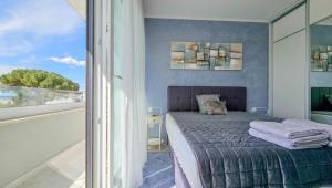 a bedroom with a bed and a large window at Sea House 1 in Novigrad Istria +34 photos