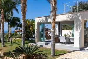 a villa with a view of the ocean at Villa Annalisa by PosarelliVillas in Pizzolungo
