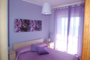 Postel nebo postele na pokoji v ubytování B&B LA BAIA Sea Rooms
