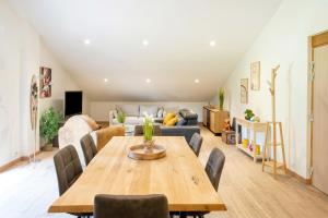 a living room with a table and a couch at Gite de Laluby in Arx