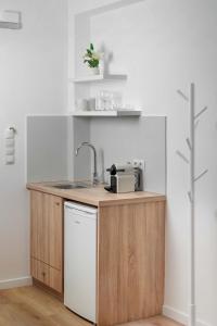 a kitchen with a sink and a counter top at Apanemo Seaside in Batsi