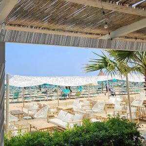 a group of chairs and umbrellas on a beach at Centro & Mare - Rooms - Garage - Suites in Termoli