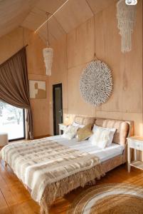 a bedroom with a large bed in a room at Boho Shale in Yablunytsya +38 photos