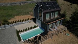an overhead view of a house with a swimming pool at Boho Shale in Yablunytsya