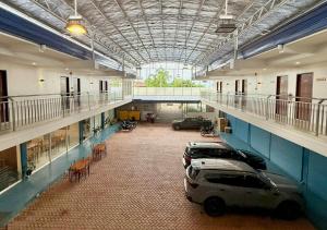 a group of cars parked in a parking lot at Cris Inn Samal in Samal