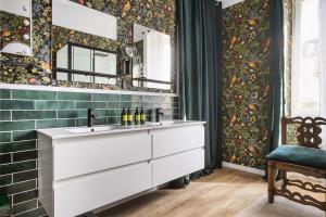 a bathroom with a sink and a mirror at Alombre in Lectoure +83 photos