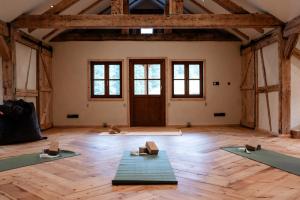 a room with three yoga mats on the floor at Auenhütte in Hirschegg