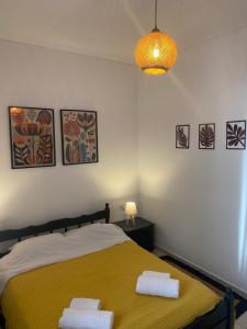 a bedroom with a bed with two towels on it at Της κυρα Τασιας in Konitsa