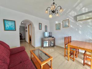 a living room with a couch and a table at Terrasol San Francisco 5ª Planta in Torre del Mar