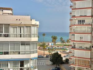 an apartment building with the ocean in the background at Terrasol San Francisco 5ª Planta in Torre del Mar