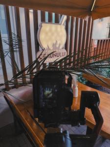 a camera on top of a coffee table at Hotel Sunset Beach Vama Veche in Vama Veche