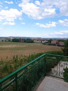 a balcony with a view of a field at La Ceramica in Appignano