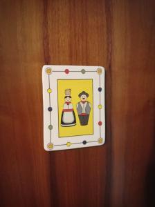 a lightswitch with a picture of two people on it at La Ceramica in Appignano