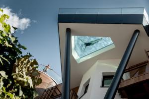 a fish sculpture on the side of a building at Das Central – Alpine . Luxury . Life in Sölden